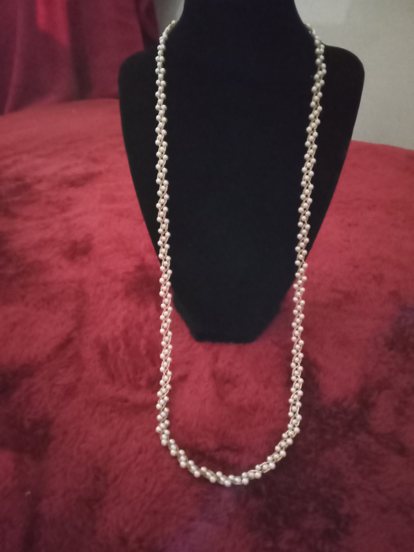 Tripled pearl beaded necklace accented in gold